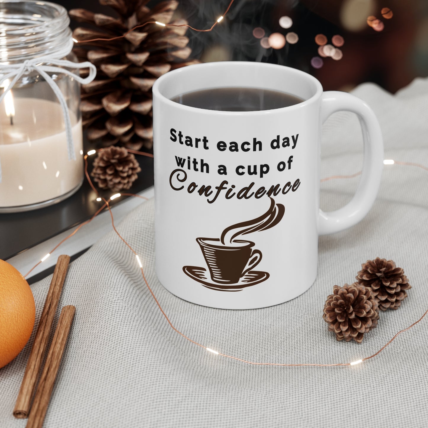 11 oz white ceramic mug with a 'Start each day with a cup of' and a graphic of  coffee mug with steam forming 'Confidence' in bold letters, uplifting and motivational design