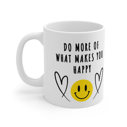 11 oz white ceramic mug with smiling emoji and hearts and 'Do More of What Makes You Happy' in bold black letters, uplifting and motivational design