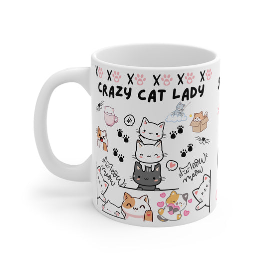 An 11oz ceramic coffee mug with text 'Crazy cat Lady' in bold lettering, featuring cute cat graphics 