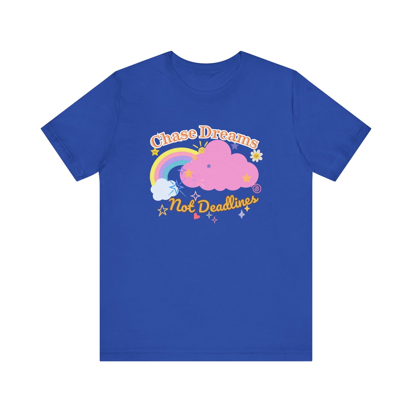 A royal blue unisex graphic t-shirt with the phrase 'Chase Dreams, Not Deadlines' in bold lettering, featuring a rainbow and soft pink cloud